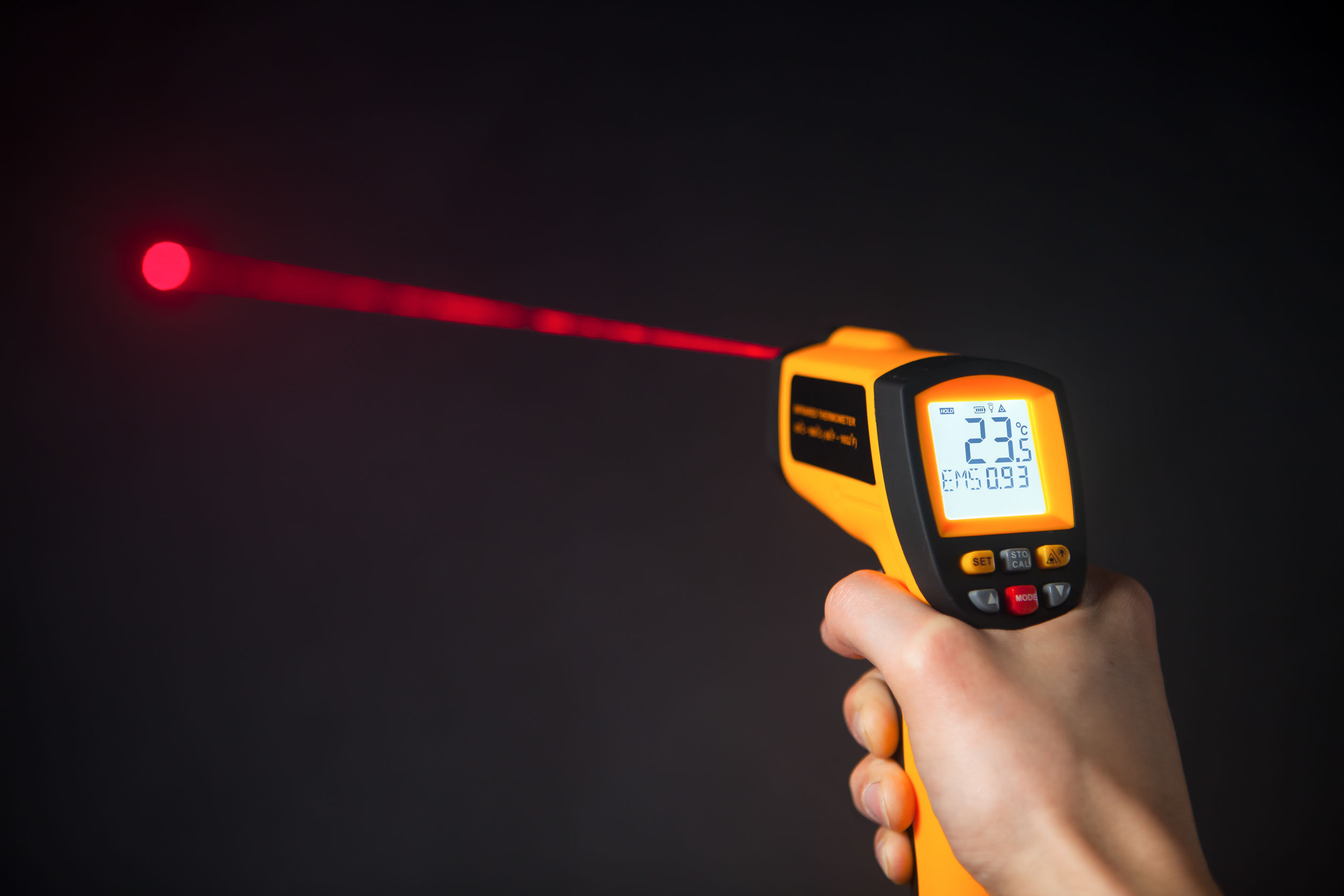 infrared laser thermometer in hand